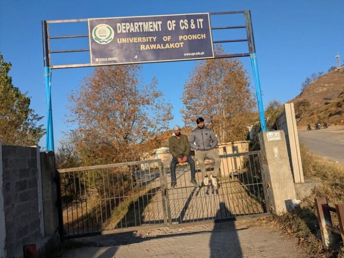 Students of University of Poonch, Rawalakot, sit on the main gate in protest, demanding fee rollback and better facilities. Photo by Saima Batool.