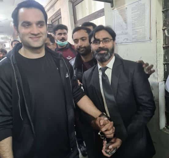 Journalist Sohrab Barkat appearing in a Lahore courtroom during his hearing, handcuffed and under security. Journalist Sohrab Barkat appearing in a Lahore courtroom during his hearing, handcuffed and under security.
