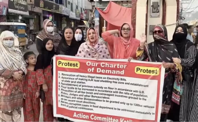In the Kotli protest, women holding banners