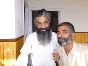 Liaqat Sain with his brother who cared for him during recovery from a fractured arm; the brother lives with family in Muzaffarabad.