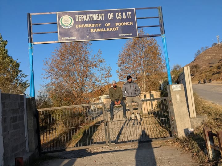 Students of University of Poonch, Rawalakot, sit on the main gate in protest, demanding fee rollback and better facilities. Photo by Saima Batool.