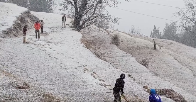Local children enjoy a game of cricket amid recent heavy snowfall in Kashmir, blending winter fun with their favorite sport.