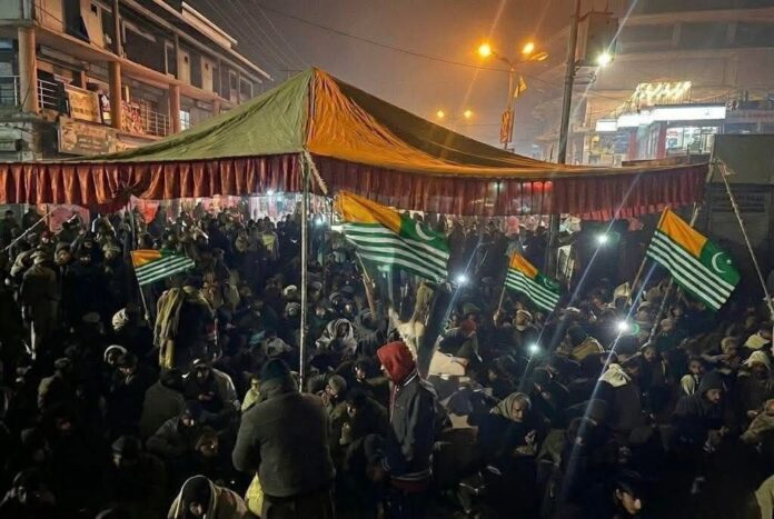 “Night-time protest by the Jammu and Kashmir Joint Awami Action Committee in Rawalakot on December 17, 2025, as residents sit on roads in sub-zero temperatures demanding restoration of electricity in Pakistan-administered Kashmir.”