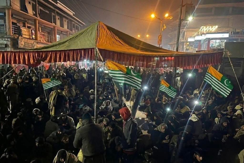 “Night-time protest by the Jammu and Kashmir Joint Awami Action Committee in Rawalakot on December 17, 2025, as residents sit on roads in sub-zero temperatures demanding restoration of electricity in Pakistan-administered Kashmir.”