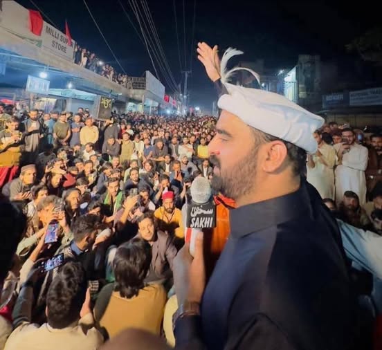 Sardar Aman Khan, newly elected Zonal President of the Jammu Kashmir Liberation Front (JKLF), addressing delegates during the zonal convention in Kotli, with party leaders and activists gathered in the background.