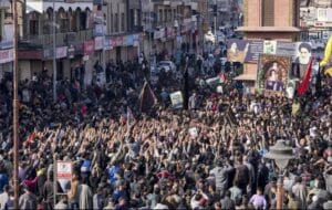 Demonstrators hold portraits of Iran’s Supreme Leader during protests in Srinagar over assassination reports.