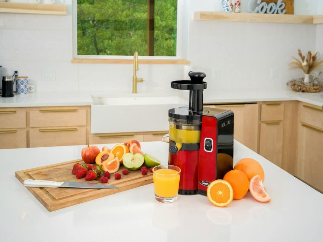a juicer sitting on top of a kitchen counter